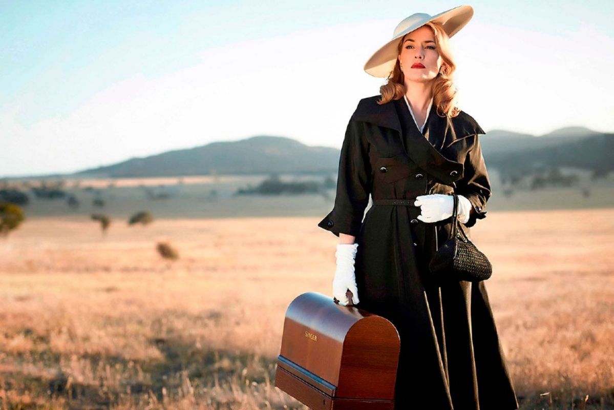 Woman with suitcase in The Dressmaker