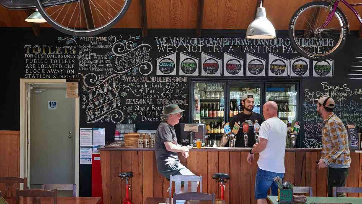 People drinking inside a brewery