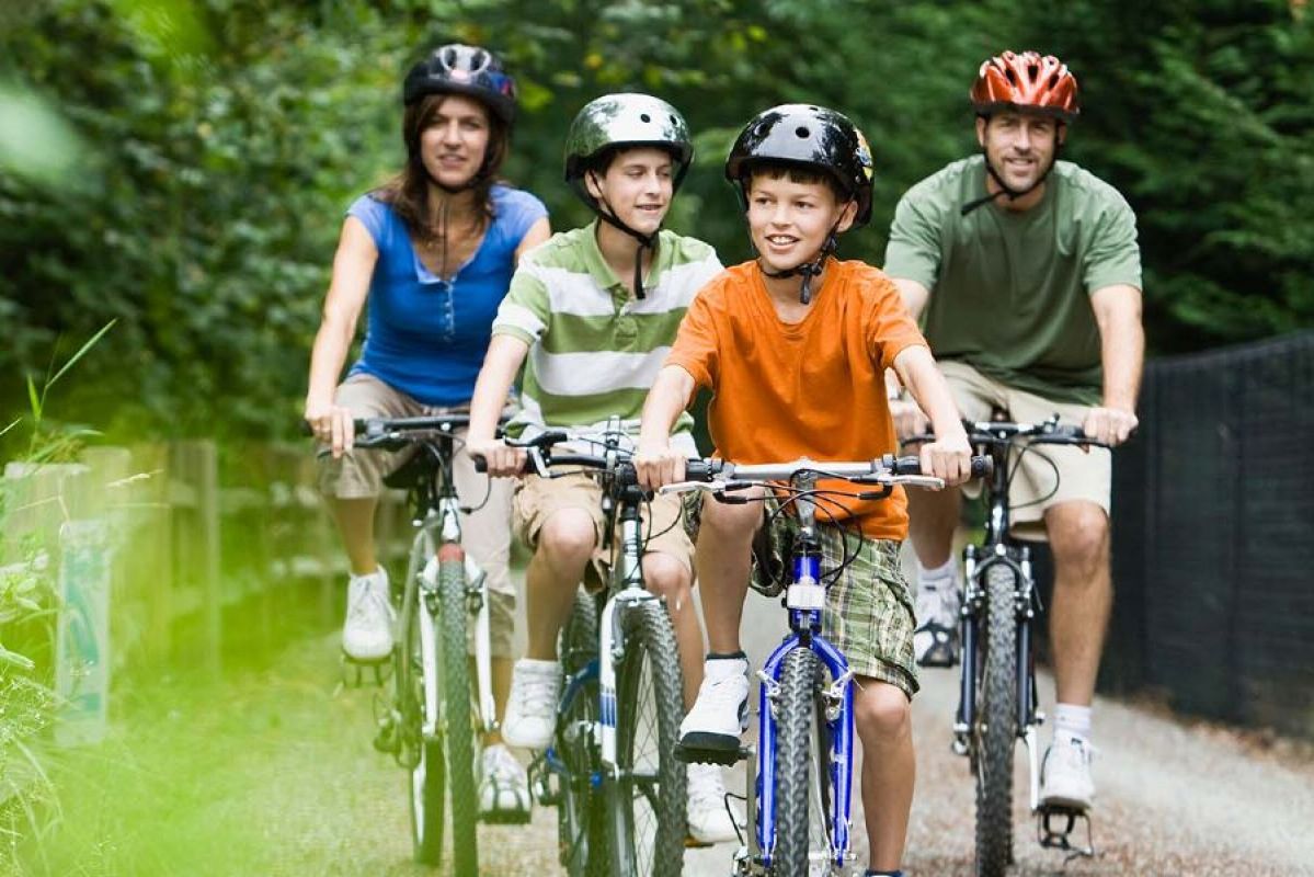 Family cycling through the wilderness