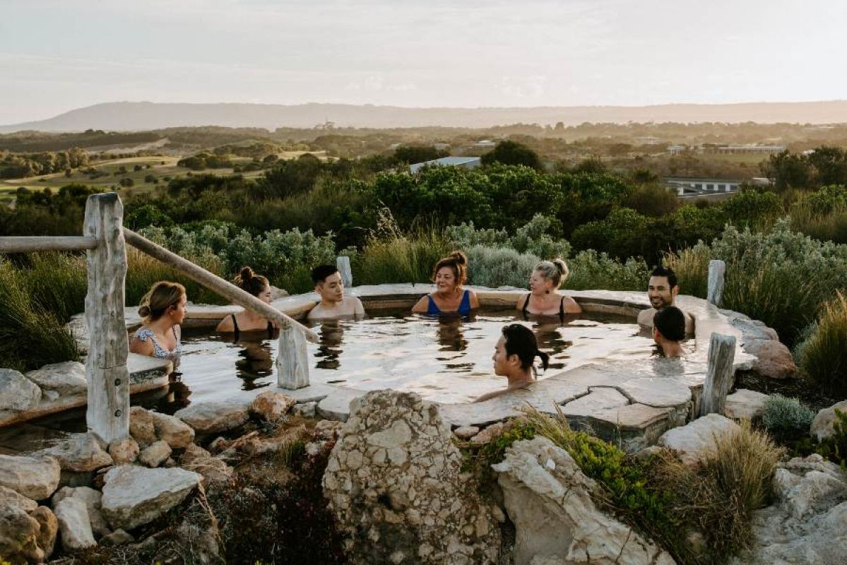group of people bathing in a Peninsula Hot Springs pool