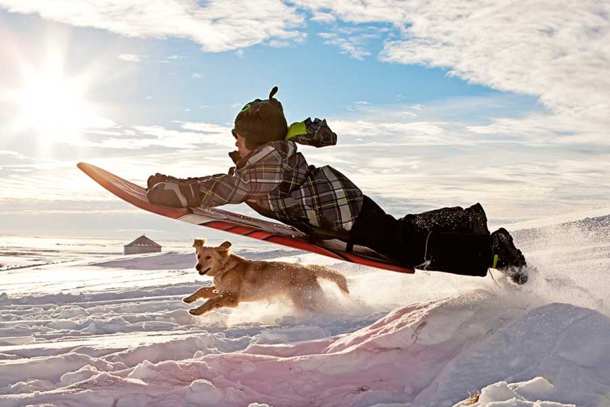 child on toboggan