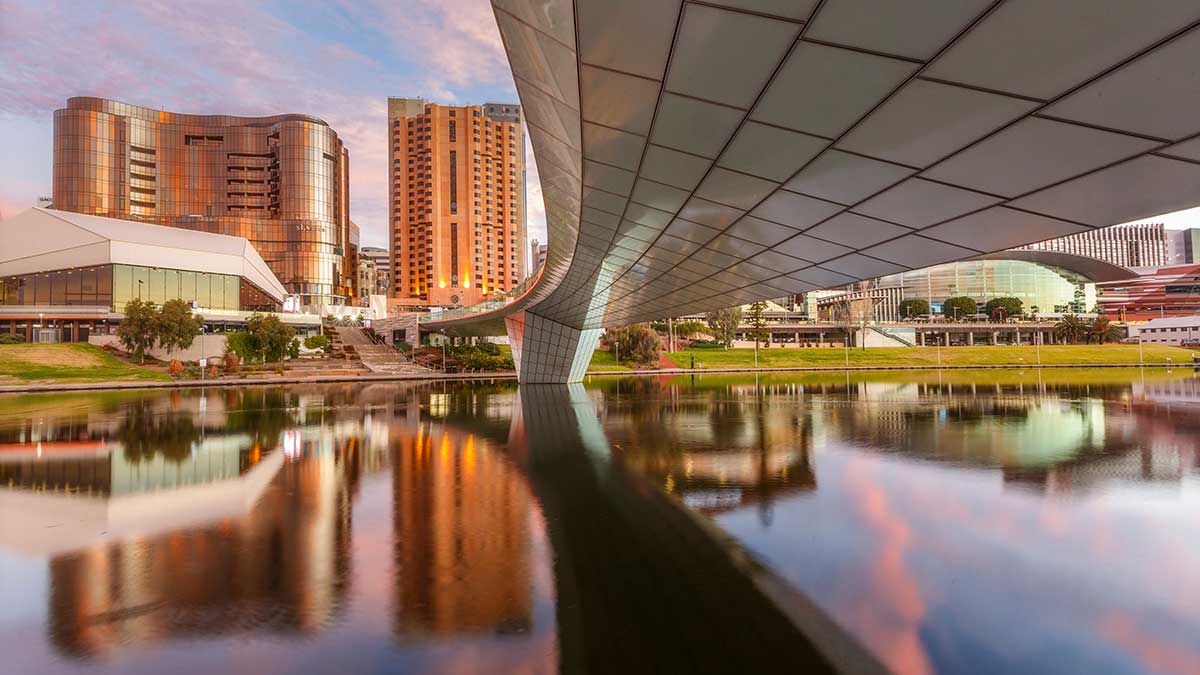 river with bridge and building in the background