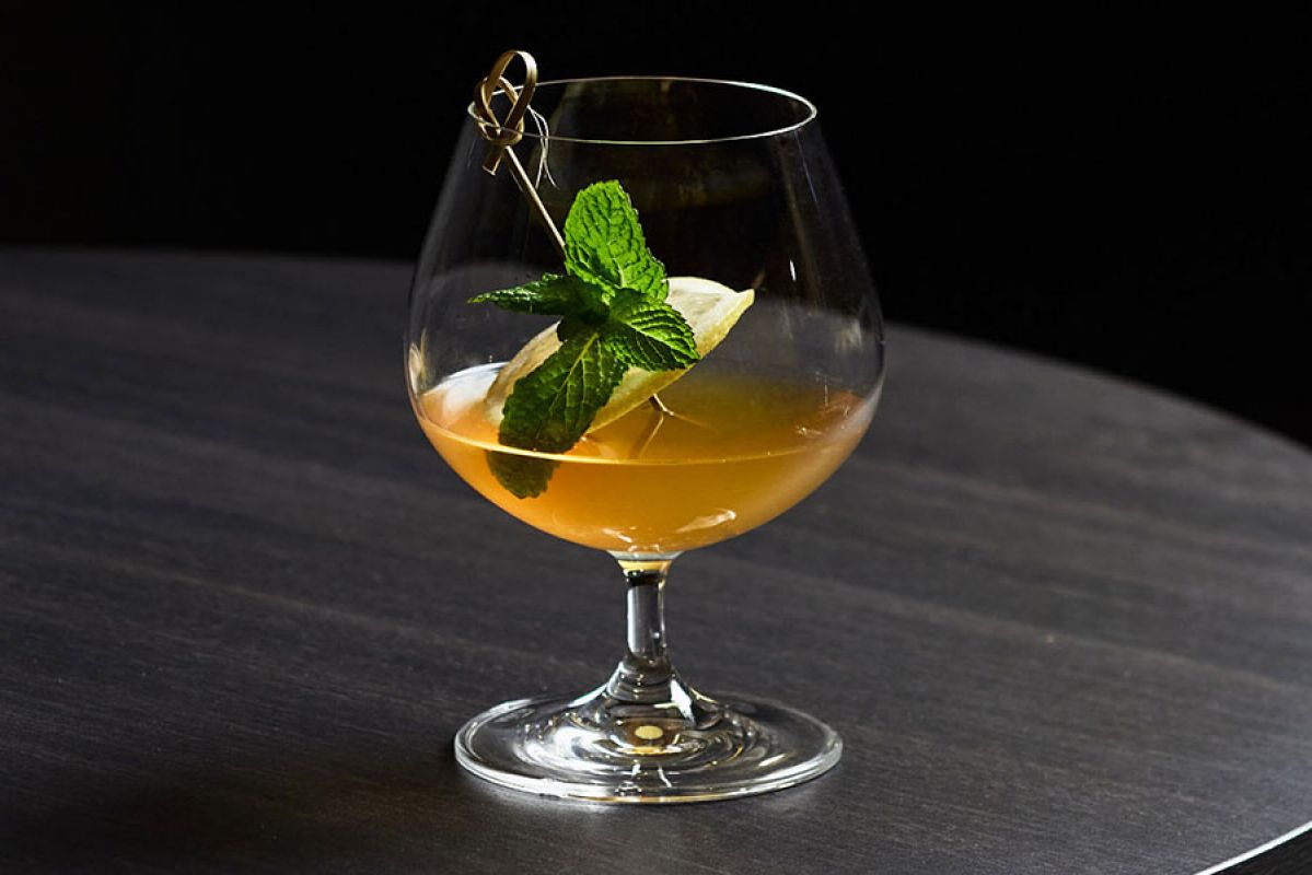 Warm Amaretto cocktail served in a brandy glass