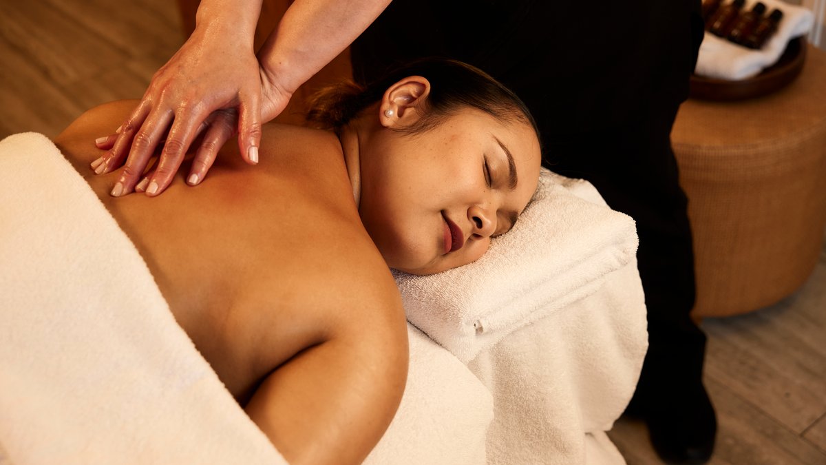 A woman in a swimsuit relaxing at One Spa RACV Torquay Resort