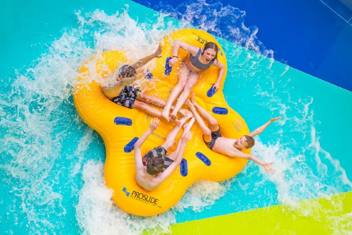 four children on a water ride