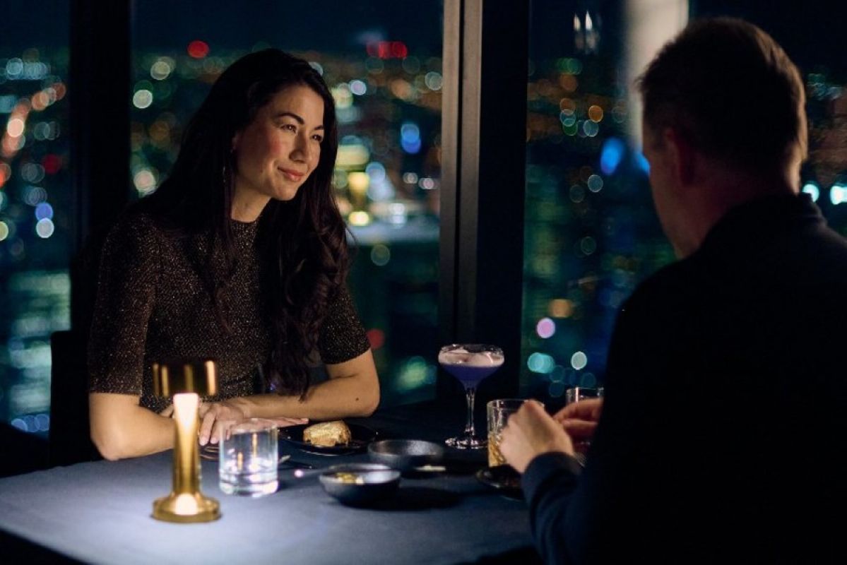two people on a date in a skyrise restaurant