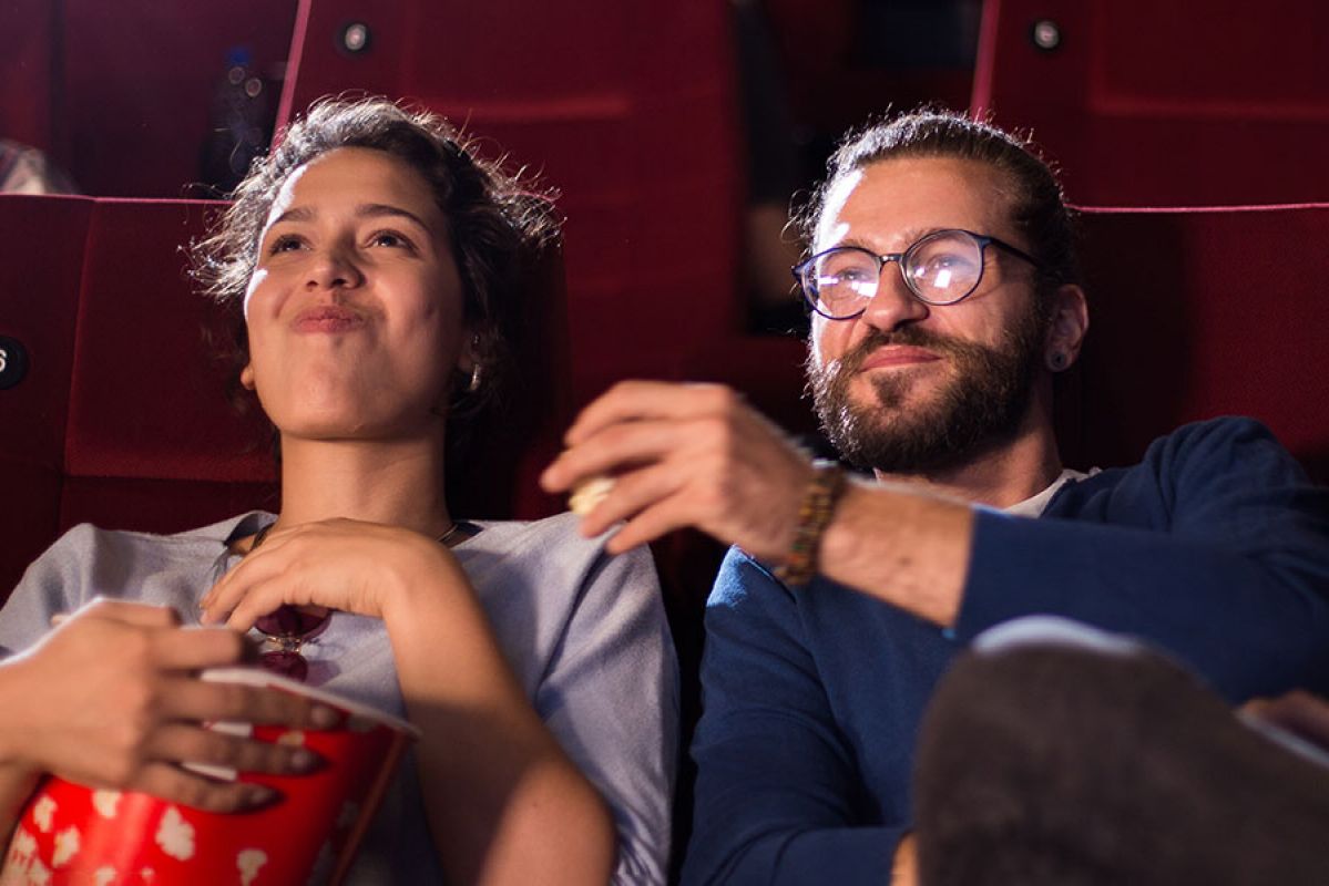 couple laughing in the cinema