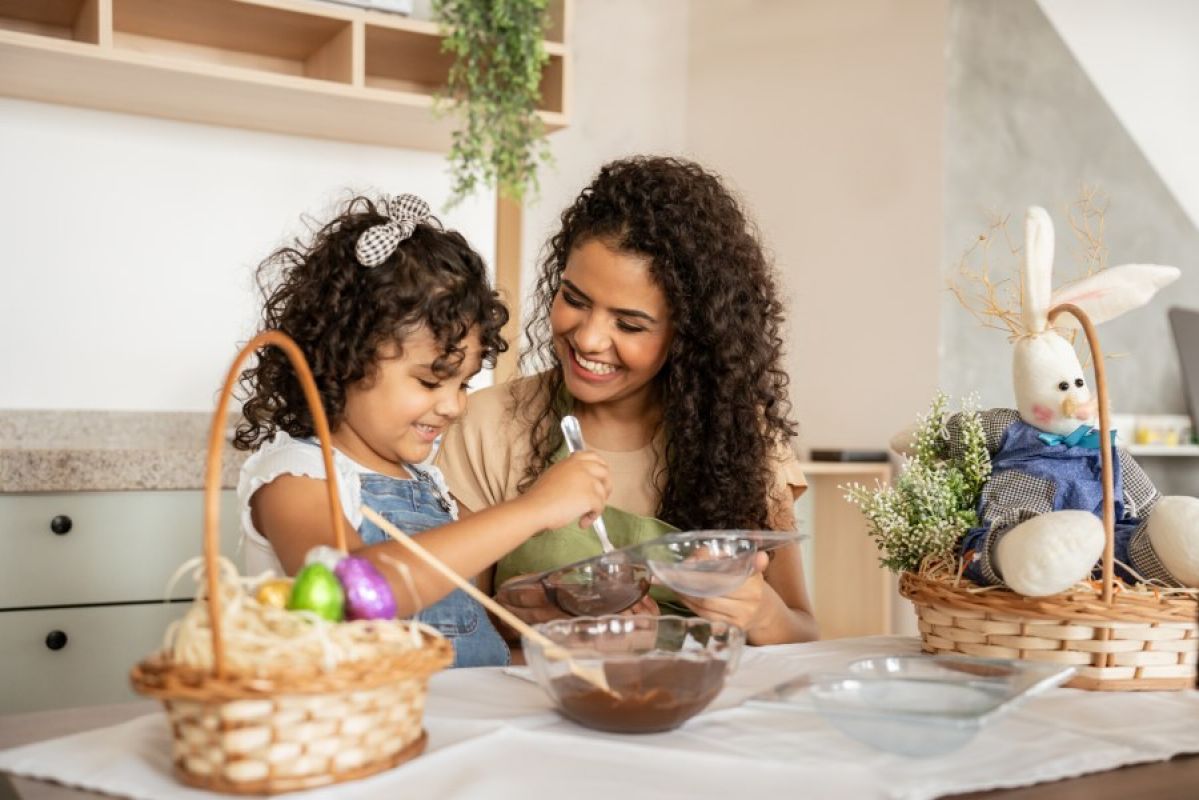 mother and child baking together with Easter decorations nearby