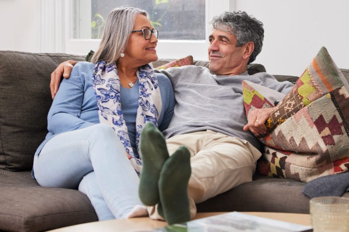 senior couple relaxing on couch