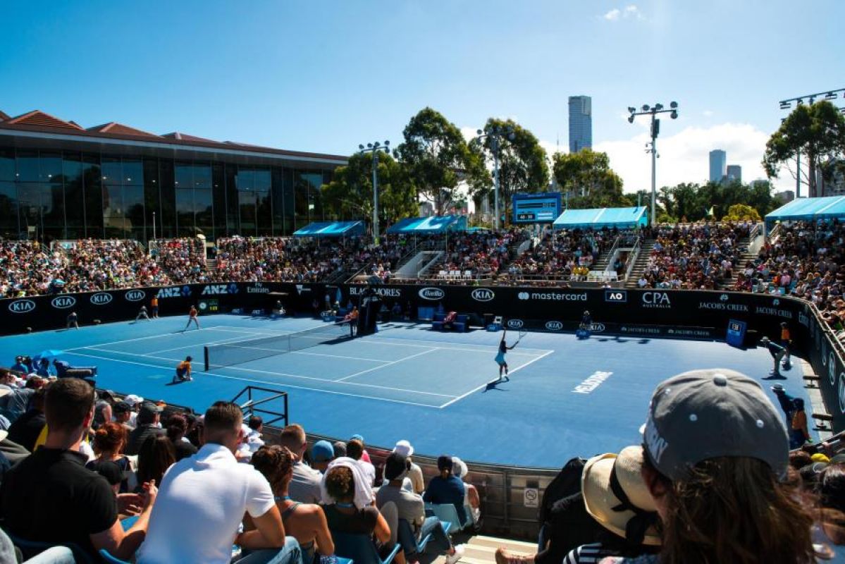Tennis fans watch match at an outside court at the Australian Open
