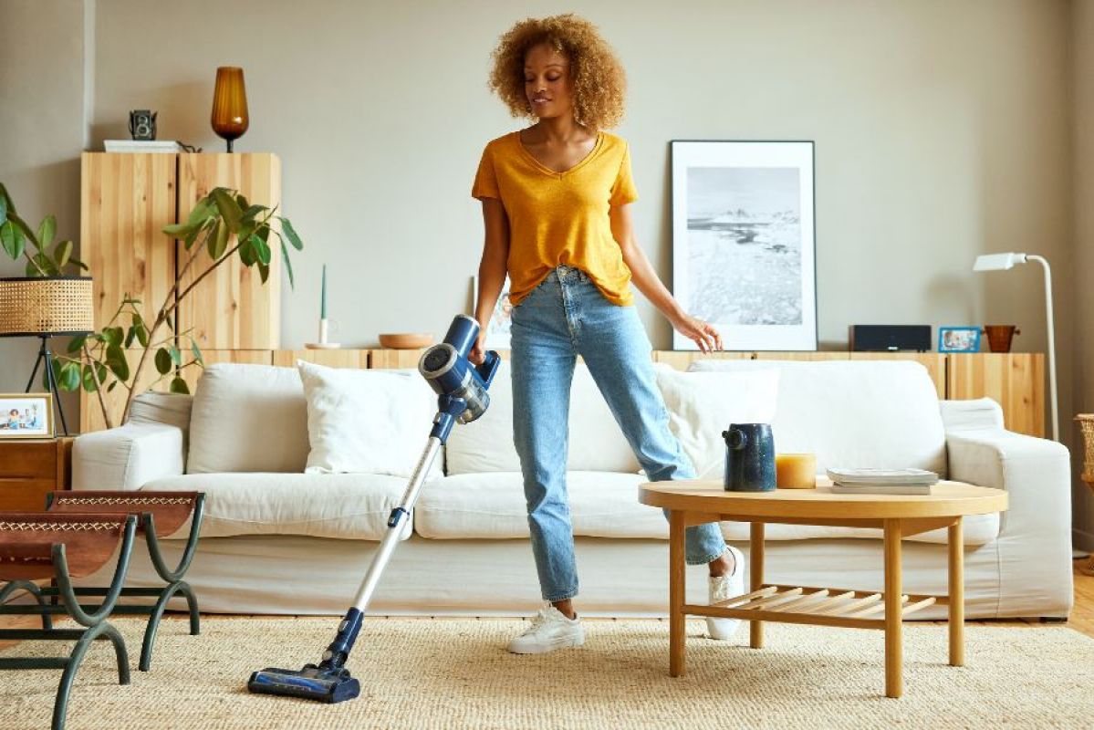 Woman vacuuming living room