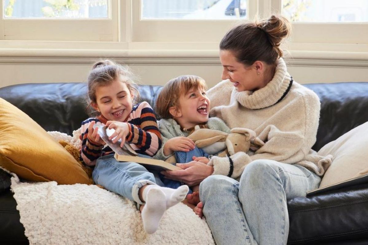 Family smiling in their home