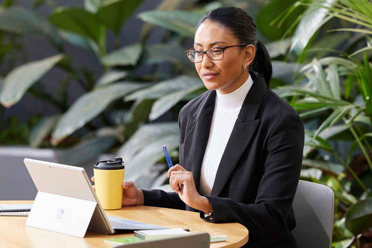 professional woman looking at laptop