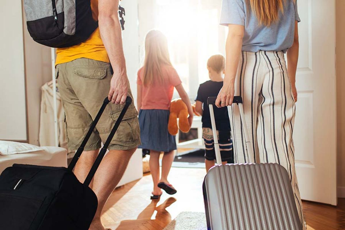 family leaving home on holiday