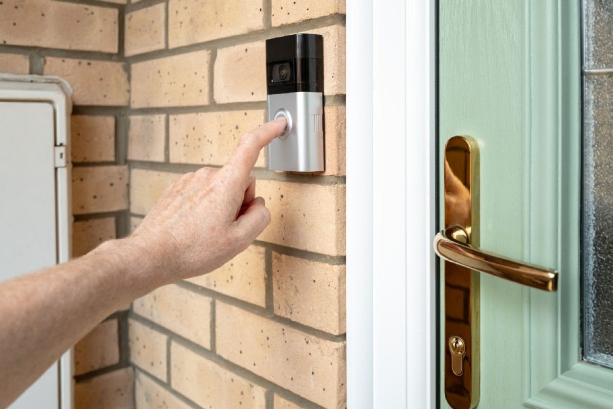 person ringing video doorbell