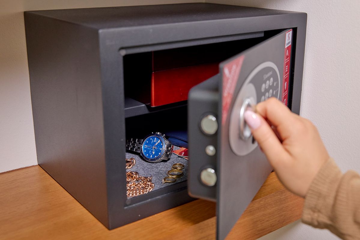 person unlocking a home safe