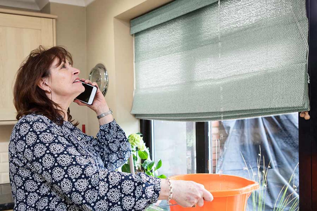 RACV plumber working on kitchen tap