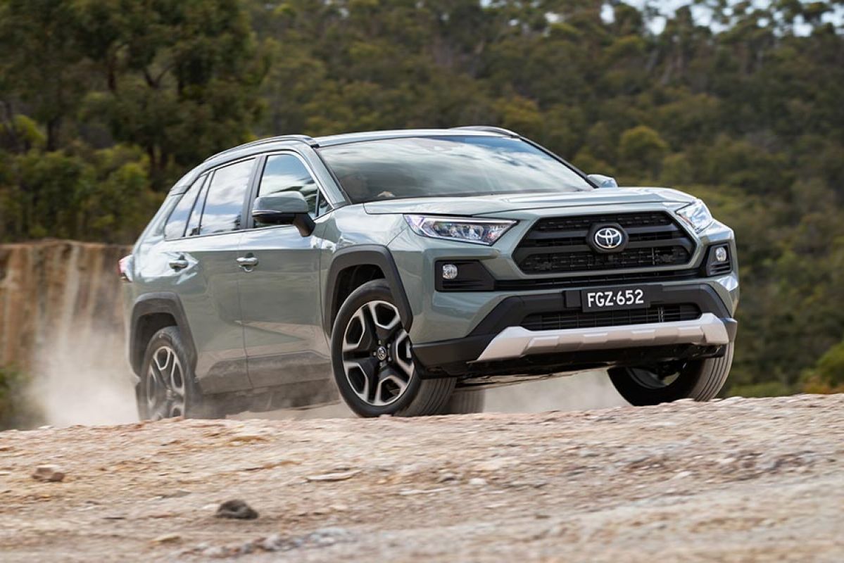 Toyota RAV4 Edge 4WD medium SUV in ‘jungle khaki’ colour at top of steep off-road incline in quarry