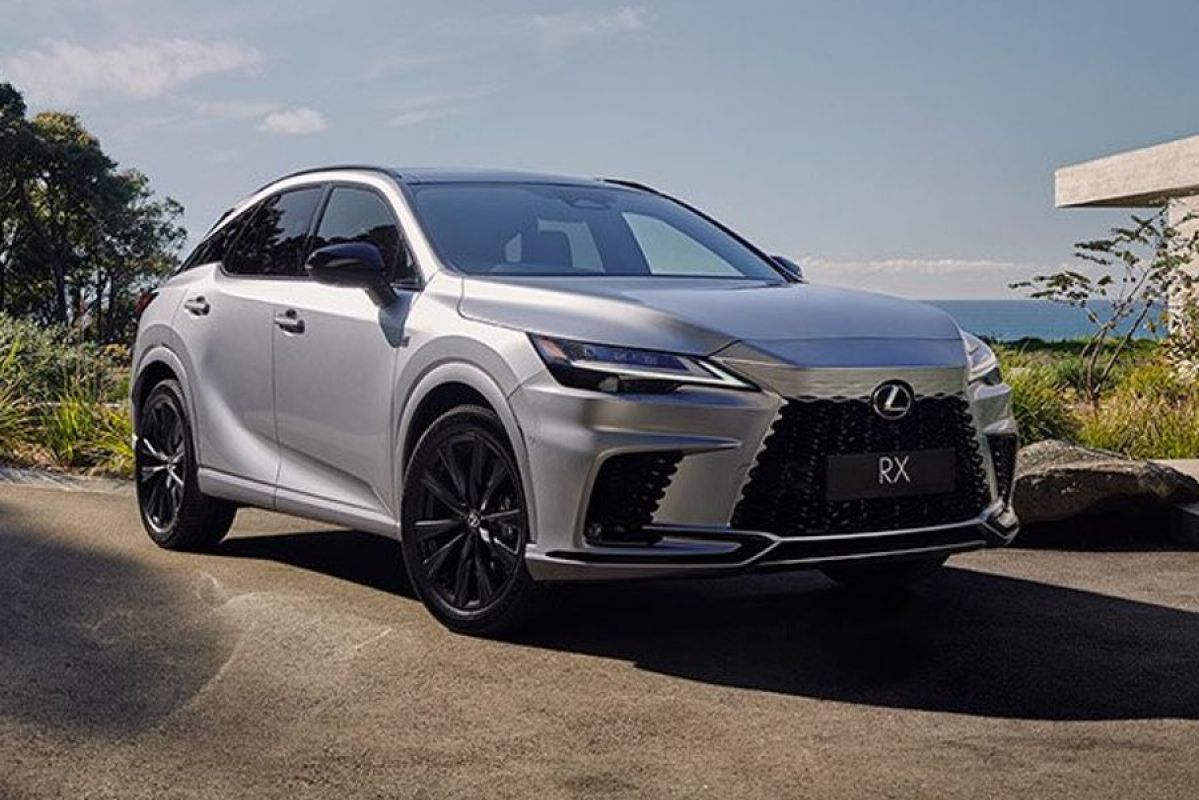 white Lexus RX parked outside house