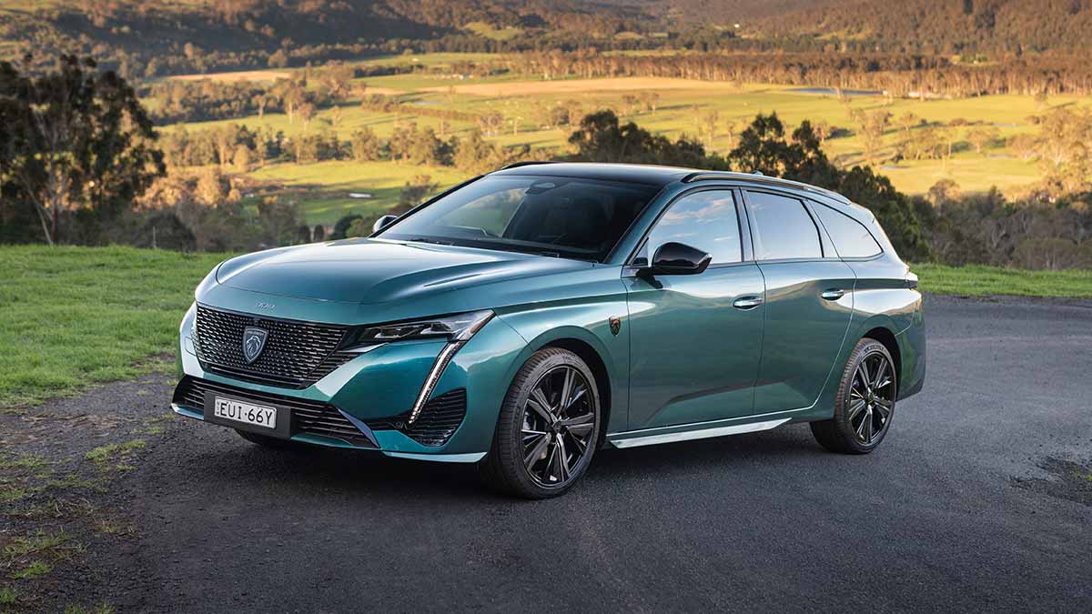 Green Peugeot 308 GT Premium Wagon on road