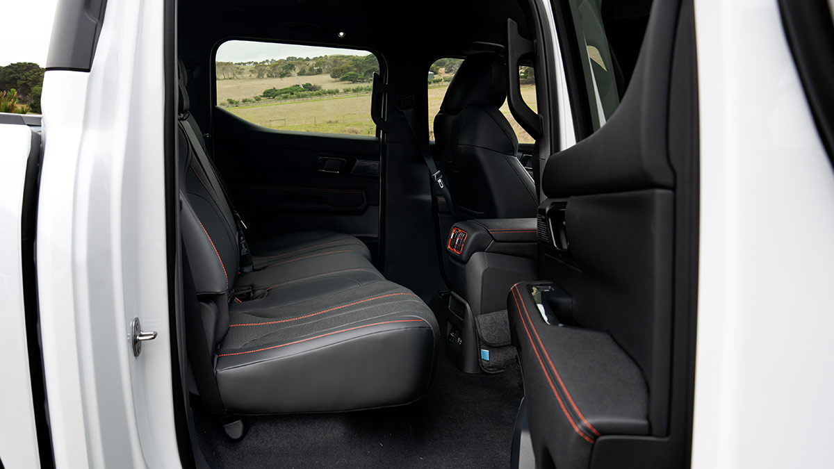 Rear door open of BYD Shark 6 dual-cab ute looking into rear seat area