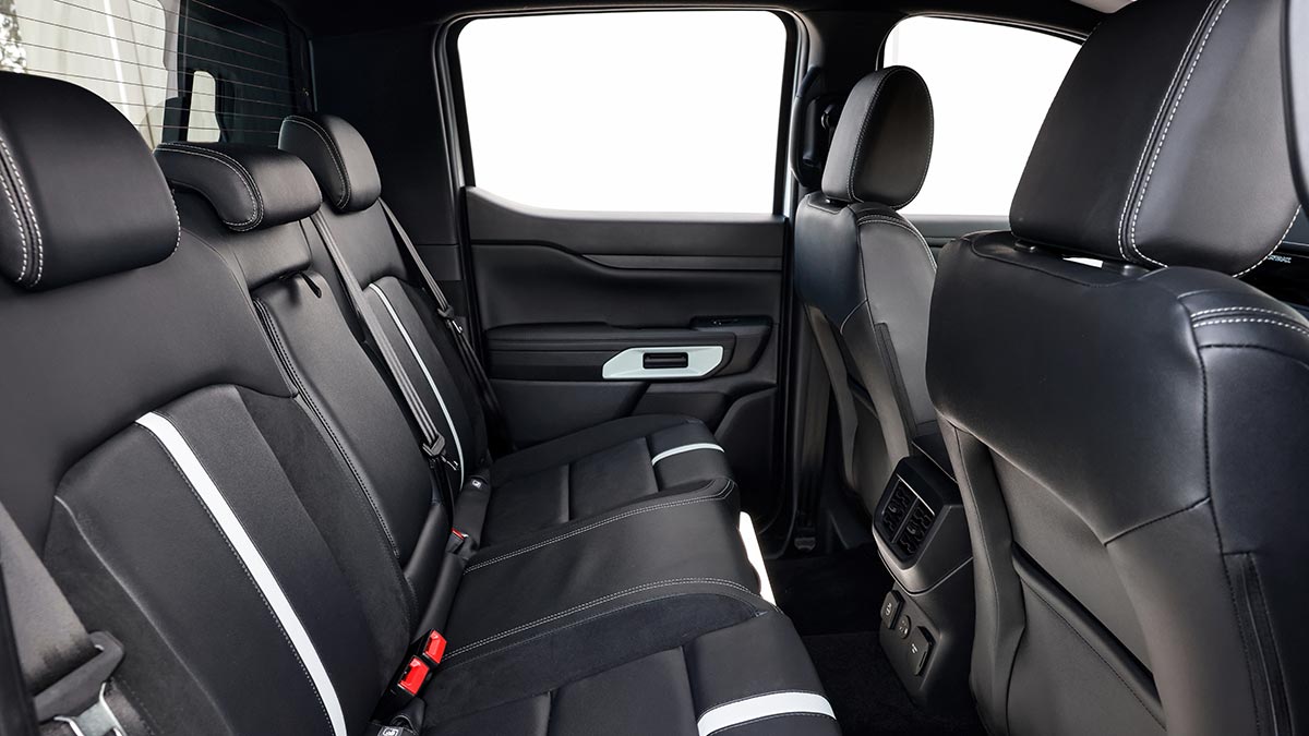 Rear seat compartment of Ford Ranger PHEV Stormtrak with leather upholstery and white trim highlights