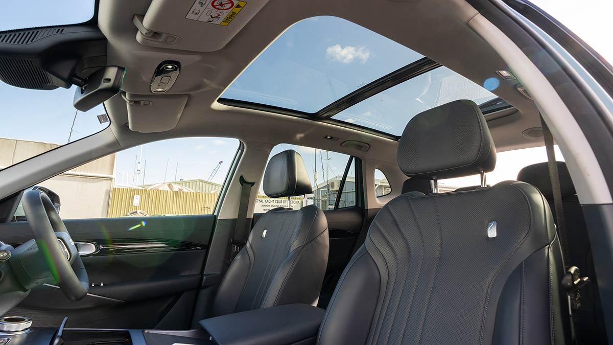 Interior of Geely EX5 Inspire medium SUV with view out of panoramic sunroof