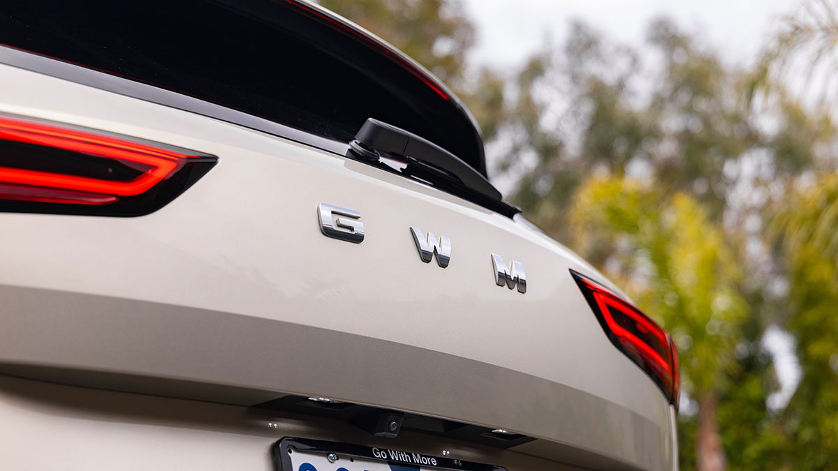 Tailgate of pearl-coloured Haval H6 plug-in hybrid SUV showing new GWM badge.