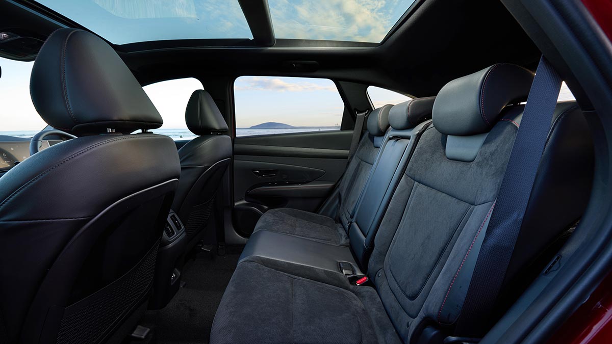 Rear compartment with plush seats and panoramic glass roof in Hyundai Tucson Premium N Line Hybrid SUV