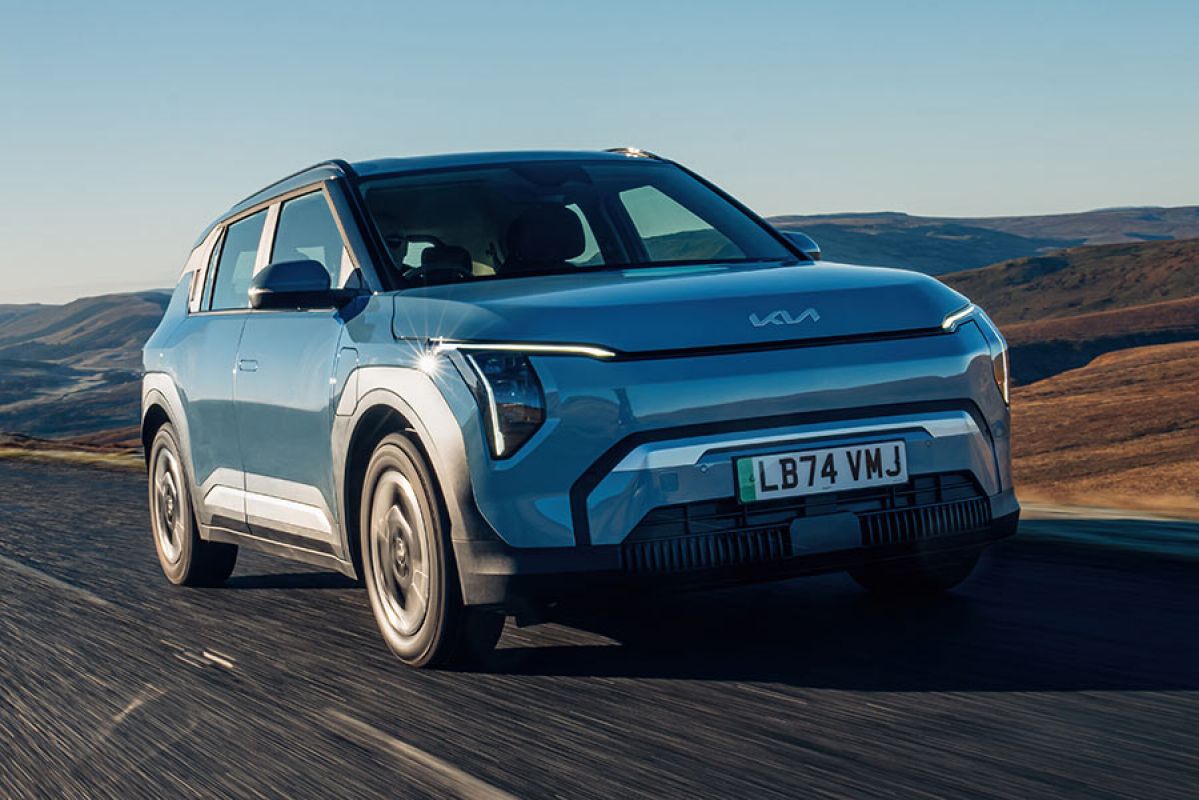 Blue Kia EV3 electric SUV on isolated road in the UK