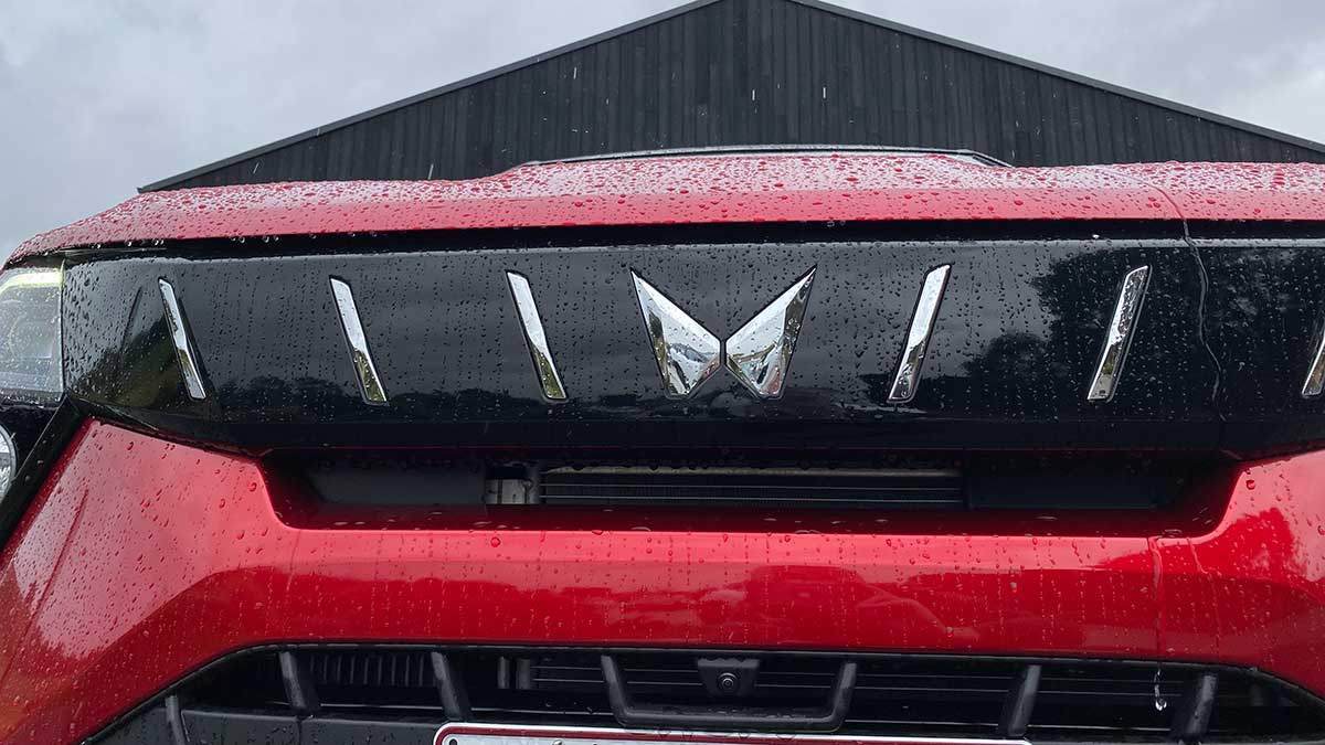 Close-up of grille and front camera of Mahindra XUV 3XO small SUV 