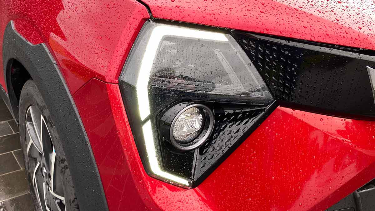 C-shaped daytime running light on red Mahindra XUV 3XO small SUV 