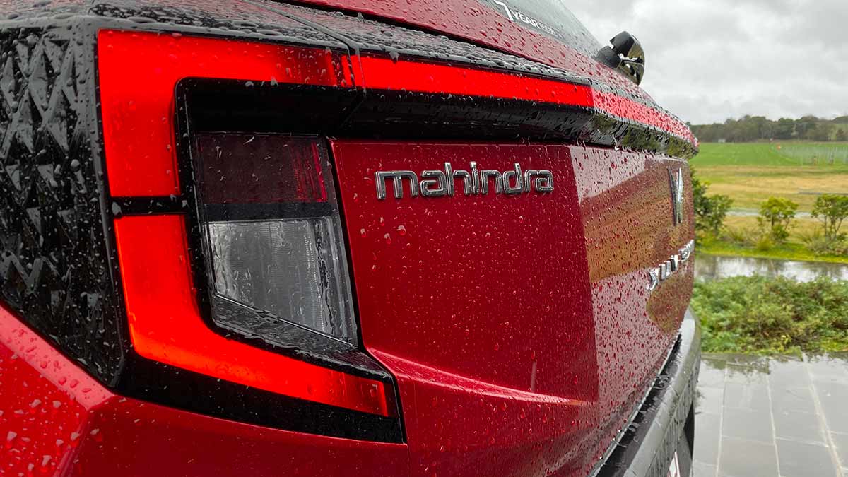 Close-up of tail-light of red Mahindra 3XO small SUV