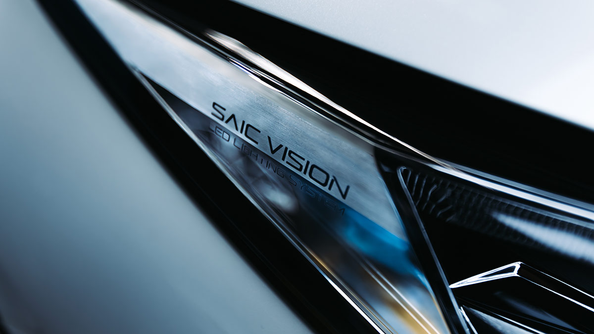 Slimline LED headlights on MG HS Super Hybrid Essence SUV with 'SAIC Vision' printed on plastic casing