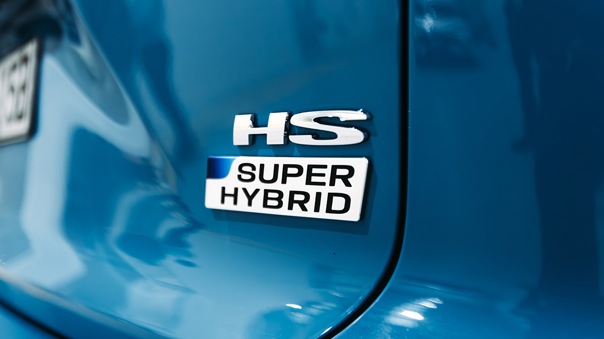 'HS Super Hybrid' badge on tailgate of blue MG HS medium-size SUV.