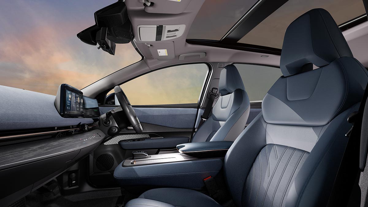 front seats and overhead sunroof of Nissan Ariya medium electric SUV