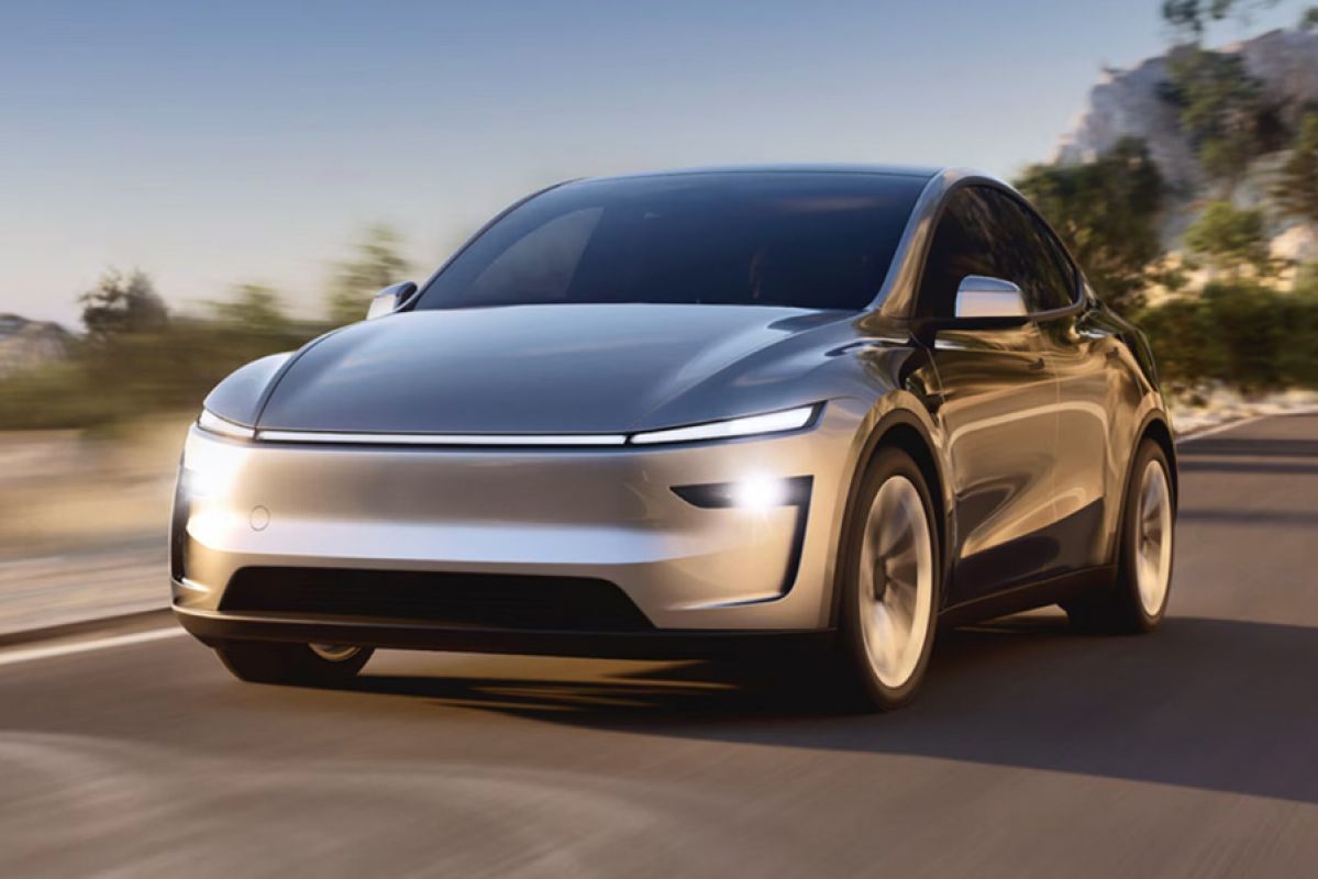 Frontal shot of silver 2025 Tesla Model Y on the road