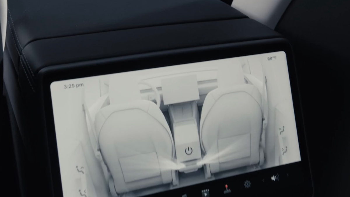 Touchscreen behind centre console of Tesla Model Y EV