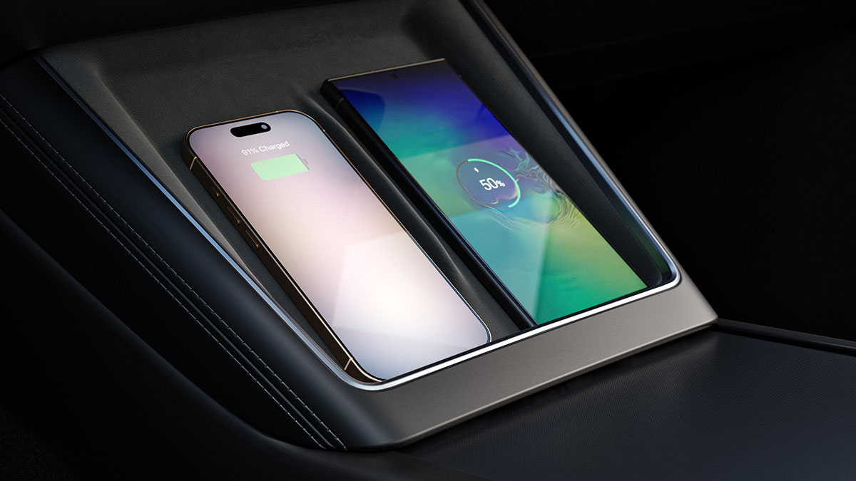 Dual wireless phone charging console below dash at front of Tesla Model Y SUV
