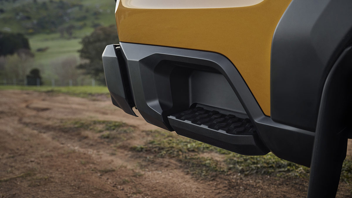 Step built into the bumper at right rear corner of gold Toyota HiLux SR5 dual-cab ute.