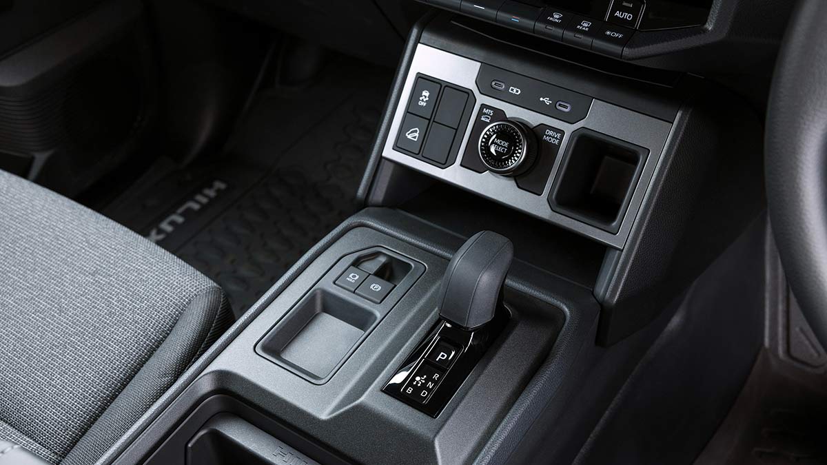 Centre console of Toyota HiLux EV with new shift-by-wire controller and blank areas where 4WD switches normally reside.