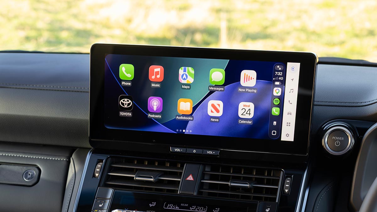 Centre touchscreen on dash of Toyota LandCruiser Hybrid Sahara ZX showing app icons.