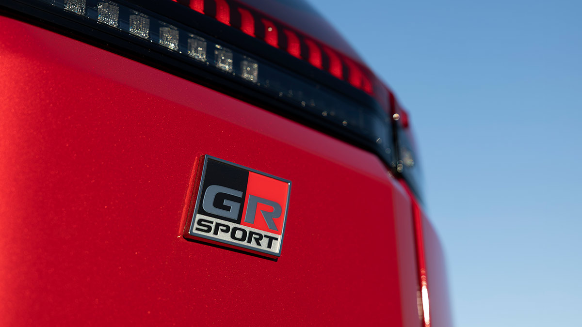 GR Sport badge on tailgate of red Toyota RAV4 GR Sport medium SUV.