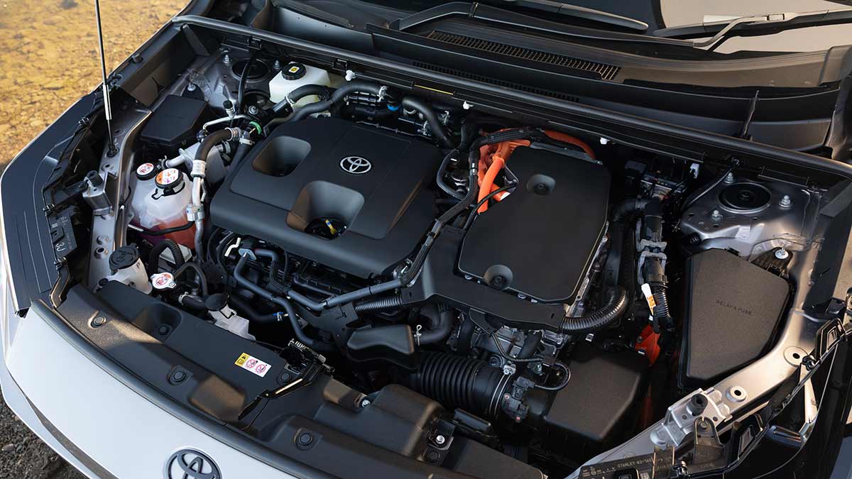 View under bonnet of silver Toyota RAV4 PHEV XSE with petrol engine and hybrid electric system. 