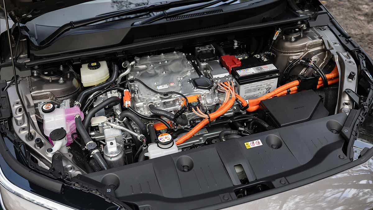 View under bonnet of Toyota bZ4X Touring electric SUV with all room taken up by dual-motor powertrain.