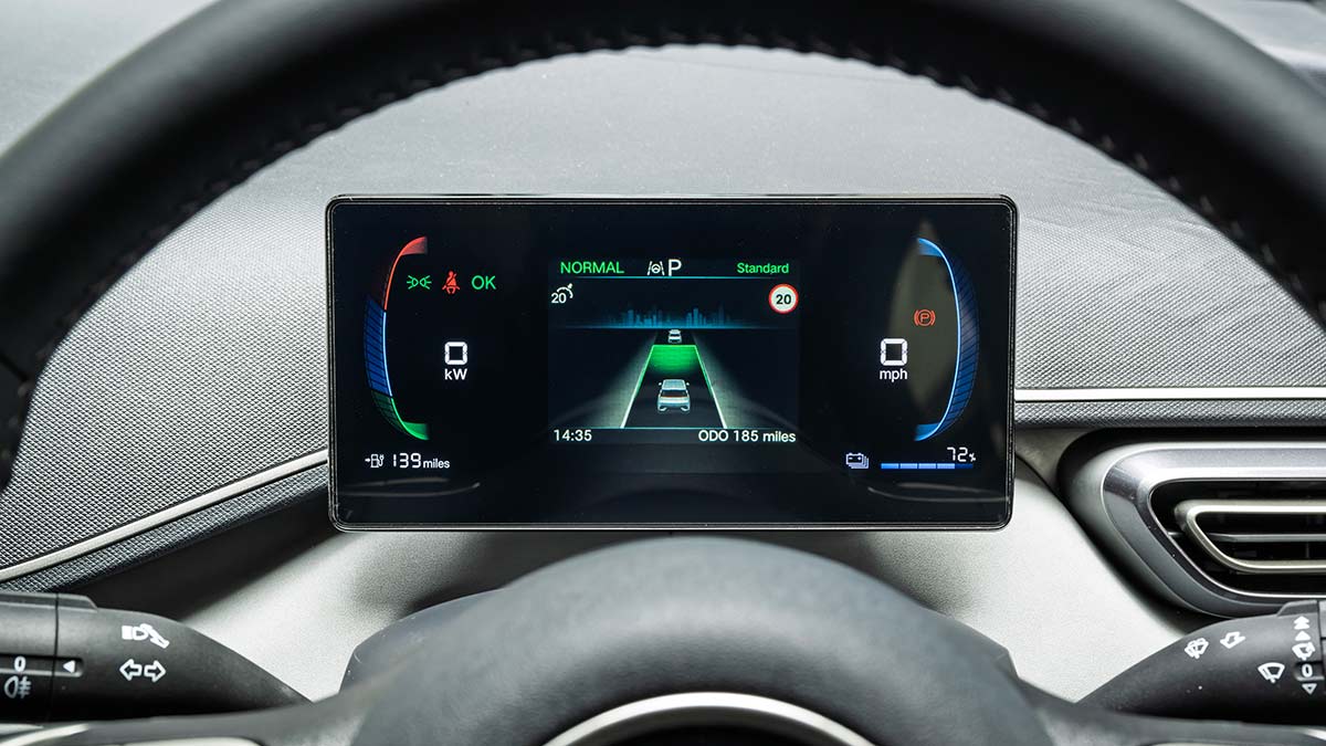 Driver's digital instrument display panel behind steering wheel of BYD Atto 1 city hatch.
