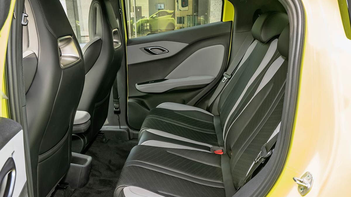 Rear seat area inside lime green BYD Atto 1 compact hatch.