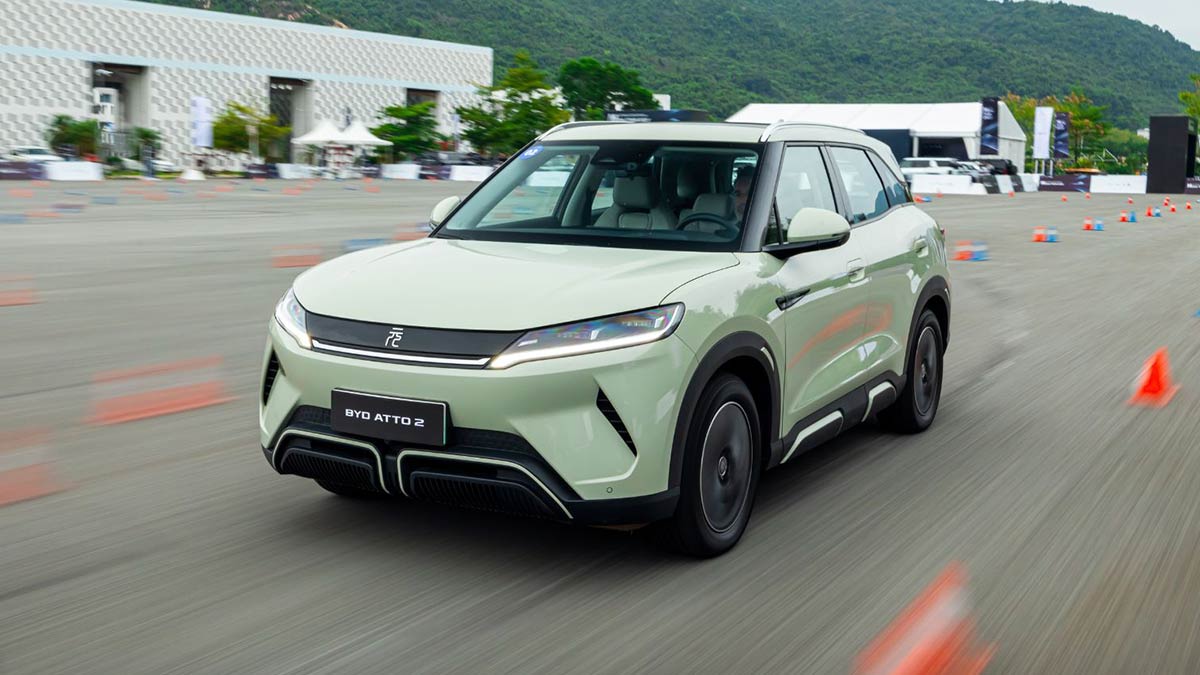 Light green BYD Atto 2 small electric SUV driving on enclosed test track in China 