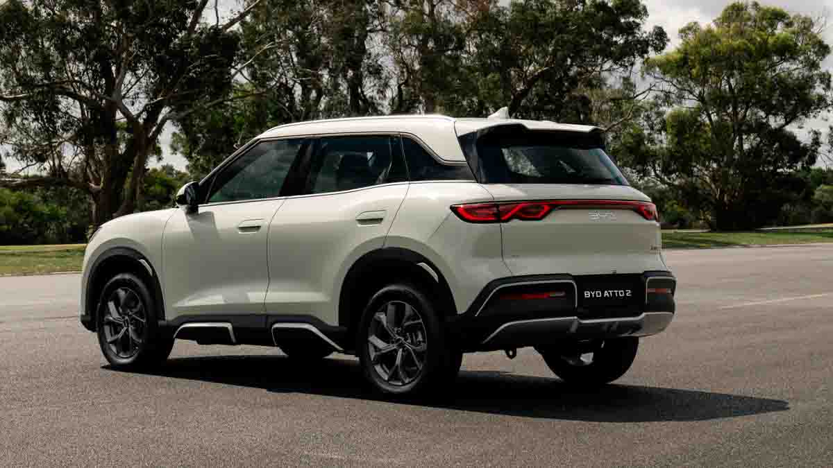 3/4 rear view of white 2026 BYD Atto 2 parked on road