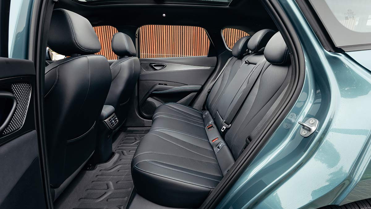 Rear seat area of BYD Seal 6 Touring with dark synthetic leather trim, flat floor and air vents.